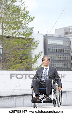 Stock Photo - Senior man on wheelchair. Fotosearch