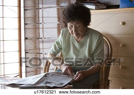 Senior Woman Reading Newspaper View Large Photo Image Stock Image - Senior Woman Reading Newspaper. Fotosearch