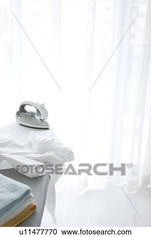 Shirts and ironing board View Large Photo Image Stock Image - Shirts and ironing board. Fotosearch
