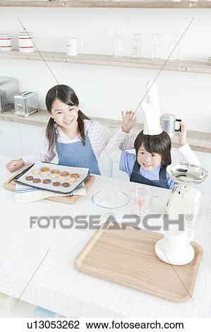 Sister and brother baking cookies, Hyogo Prefecture, Honshu, Japan View Large Photo Image Stock Image - Sister and brother baking cookies, Hyogo Prefecture, Honshu, Japan. Fotosearch