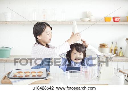 Sister and brother baking cookies, Hyogo Prefecture, Honshu, Japan View Large Photo Image Stock Image - Sister and brother baking cookies, Hyogo Prefecture, Honshu, Japan. Fotosearch
