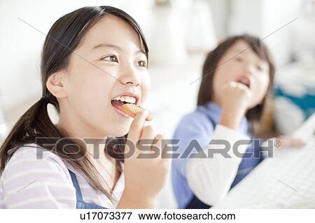 Sister and brother eating cookies, Hyogo Prefecture, Honshu, Japan View Large Photo Image Stock Photo - Sister and brother eating cookies, Hyogo Prefecture, Honshu, Japan. Fotosearch
