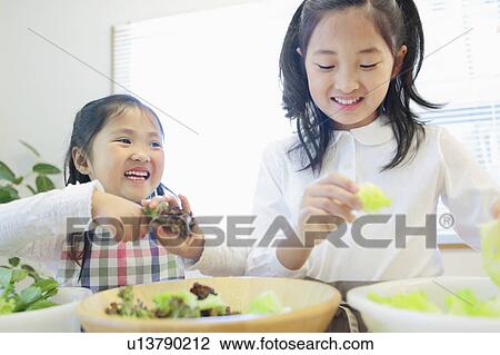 Sisters Preparing Food View Large Photo Image Stock Image - Sisters Preparing Food. Fotosearch