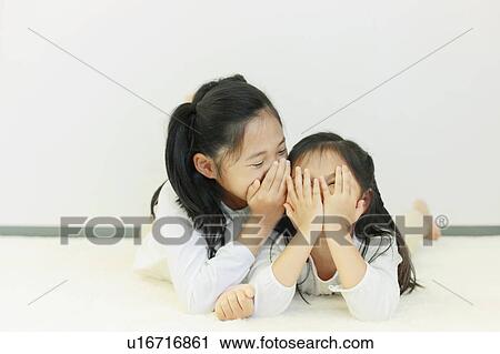 Sisters Whispering View Large Photo Image Stock Image - Sisters Whispering. Fotosearch
