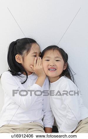 Sisters Whispering View Large Photo Image Stock Photograph - Sisters Whispering. Fotosearch