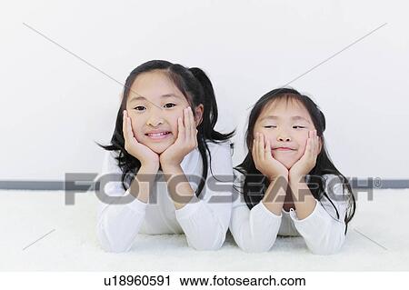 Sisters with Chin on Hands View Large Photo Image Stock Image - Sisters with Chin on Hands. Fotosearch