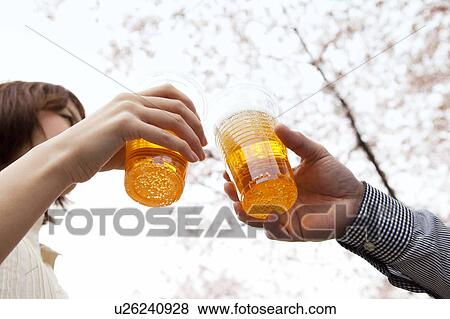 Stock Photo - Toasting with beers. Fotosearch