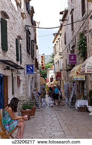 Tourists Walking in Alley View Large Photo Image Stock Photo - Tourists Walking in Alley. Fotosearch