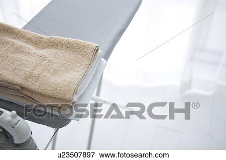 Towels and ironing board View Large Photo Image Stock Photo - Towels and ironing board. Fotosearch