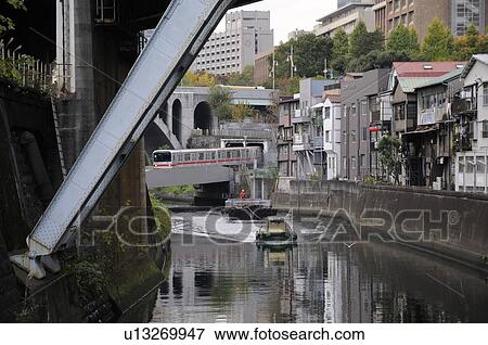 Train Crossing River Near Motorboat View Large Photo Image Stock Photo - Train Crossing River Near Motorboat. Fotosearch