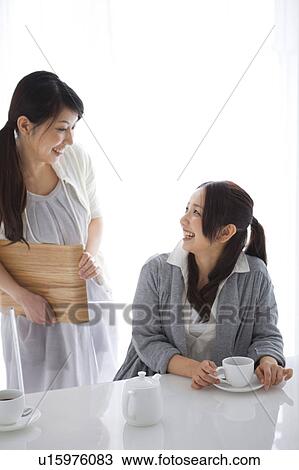 Stock Image - Women drinking coffee. Fotosearch