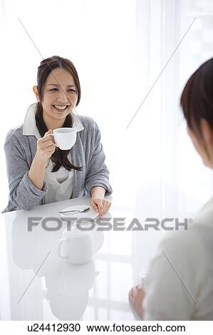 Stock Image - Women drinking coffee. Fotosearch
