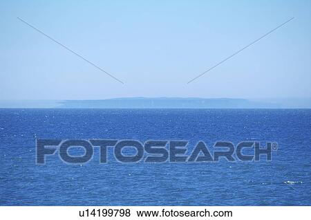 Stock Photo - Yagishiri Island and mirage, Hokkaido Prefecture, Japan. Fotosearch