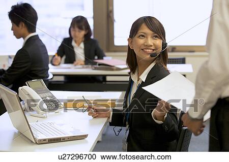Young businesswoman with headset View Large Photo Image Stock Image - Young businesswoman with headset. Fotosearch