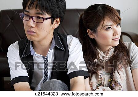 Young couple looking away View Large Photo Image Stock Image - Young couple looking away . Fotosearch