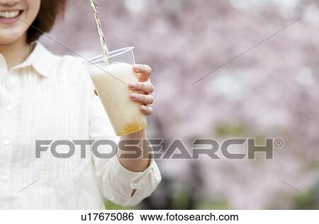 Young woman pouring beer into plastic cup View Large Photo Image Stock Photograph - Young woman pouring beer into plastic cup. Fotosearch