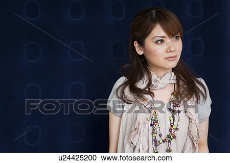 Young woman standing View Large Photo Image Stock Image - Young woman standing. Fotosearch