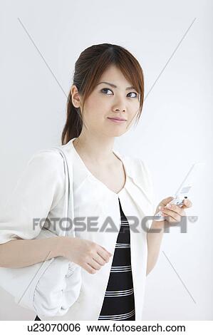 Young woman with cell phone View Large Photo Image Stock Photograph - Young woman with cell phone. Fotosearch