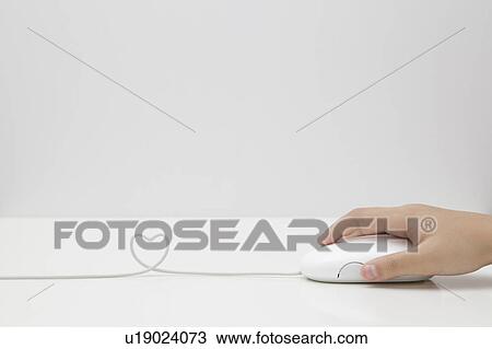 A hand holding a mouse View Large Photo Image Stock Image - A hand holding a mouse. Fotosearch