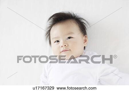 Stock Photo - Baby Boy Day Dreaming. Fotosearch
