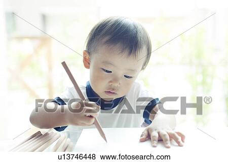 Stock Photo - Baby Boy Drawing. Fotosearch