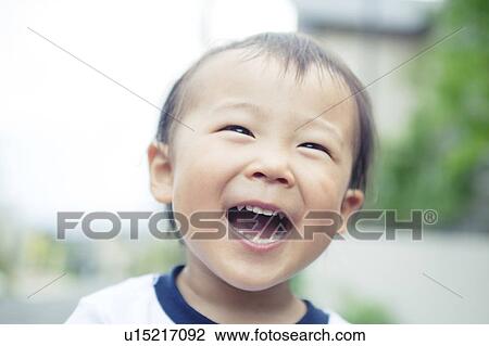 Stock Image - Baby Boy Laughing. Fotosearch