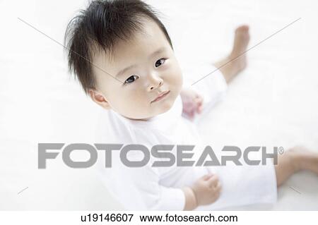 Stock Photo - Baby Boy Looking at Camera, High Angle View. Fotosearch