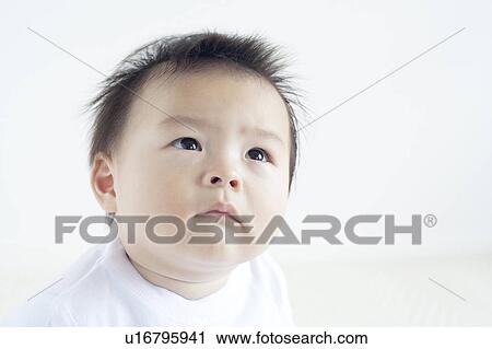 Stock Image - Baby Boy Looking Up. Fotosearch