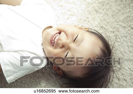 Baby Boy Lying on Floor and Laughing View Large Photo Image Stock Photography - Baby Boy Lying on Floor and Laughing. Fotosearch