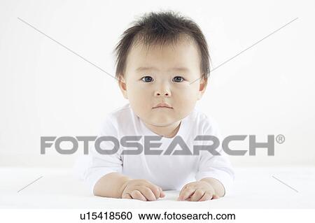 Stock Image - Baby Boy Lying on Front. Fotosearch