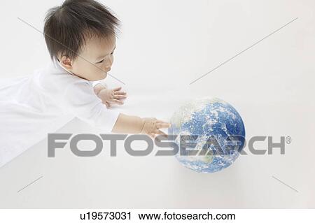 Baby Boy Playing With Globe, High Angle View View Large Photo Image Stock Image - Baby Boy Playing With Globe, High Angle View. Fotosearch