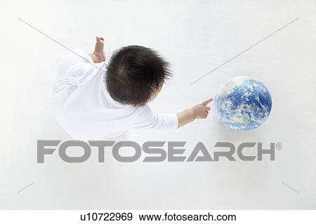 Baby Boy Playing With Globe, High Angle View View Large Photo Image Stock Photo - Baby Boy Playing With Globe, High Angle View. Fotosearch