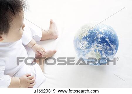 Baby Boy Playing With Globe, High Angle View View Large Photo Image Stock Photo - Baby Boy Playing With Globe, High Angle View. Fotosearch