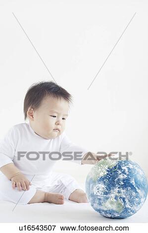 Baby Boy Playing with Globe View Large Photo Image Stock Photo - Baby Boy Playing with Globe. Fotosearch