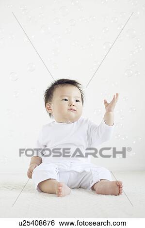 Baby Boy Surrounded by Bubbles View Large Photo Image Stock Photograph - Baby Boy Surrounded by Bubbles. Fotosearch
