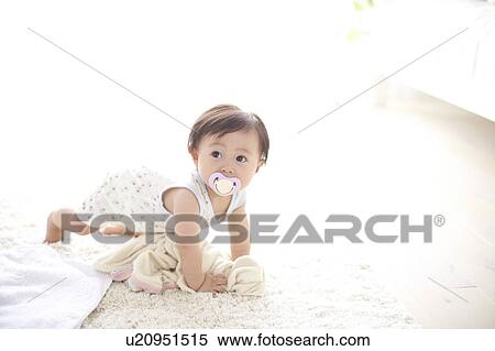 Stock Photography - Baby crawling. Fotosearch