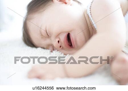 Stock Photograph - Baby crying. Fotosearch