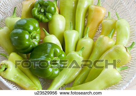 Banana peppers and green bell peppers in a basket View Large Photo Image Stock Photograph - Banana peppers and green bell peppers in a basket. Fotosearch