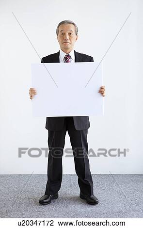 Businessman Holding Blank Message View Large Photo Image Stock Image - Businessman Holding Blank Message. Fotosearch