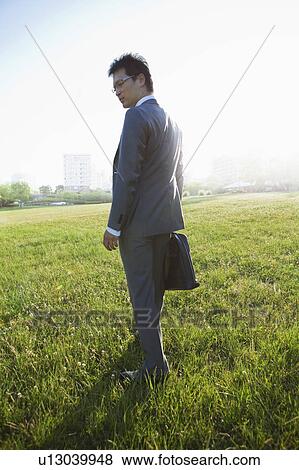 Stock Photo - Businessman in Park. Fotosearch