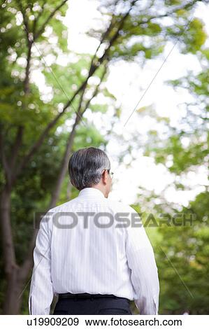 Stock Photo - Businessman in Park. Fotosearch