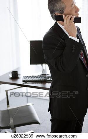 Businessman on Mobile Phone View Large Photo Image Stock Photo - Businessman on Mobile Phone. Fotosearch