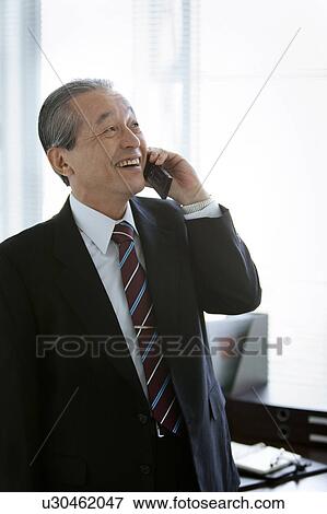 Stock Photo - Businessman on Mobile Phone. Fotosearch