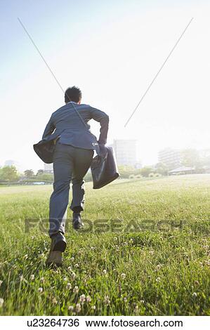 Businessman Running in Field View Large Photo Image Stock Photograph - Businessman Running in Field. Fotosearch