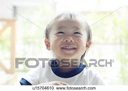 Stock Image - Cheerful Baby Boy Looking Up. Fotosearch