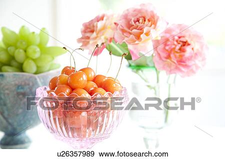 Cherries in a glass and roses in vase View Large Photo Image Stock Photo - Cherries in a glass and roses in vase. Fotosearch