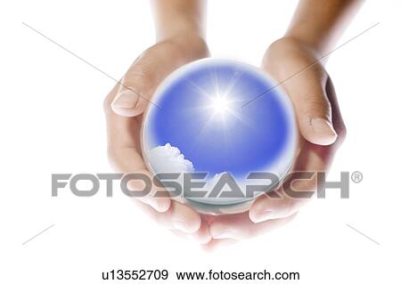 Stock Photo - Child Holding Globe Showing Sun and Sky. Fotosearch