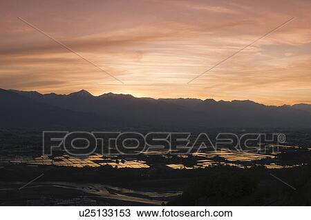 Stock Image - Cityscape of Azumino at dusk, Nagano Prefecture, Japan. Fotosearch