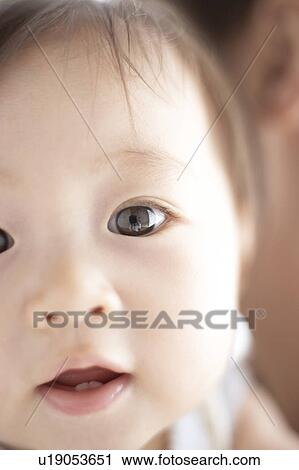 Stock Image - Close-up of baby's face. Fotosearch