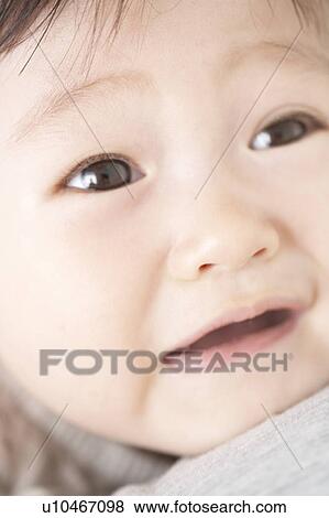 Stock Photo - Close-up of baby's face. Fotosearch